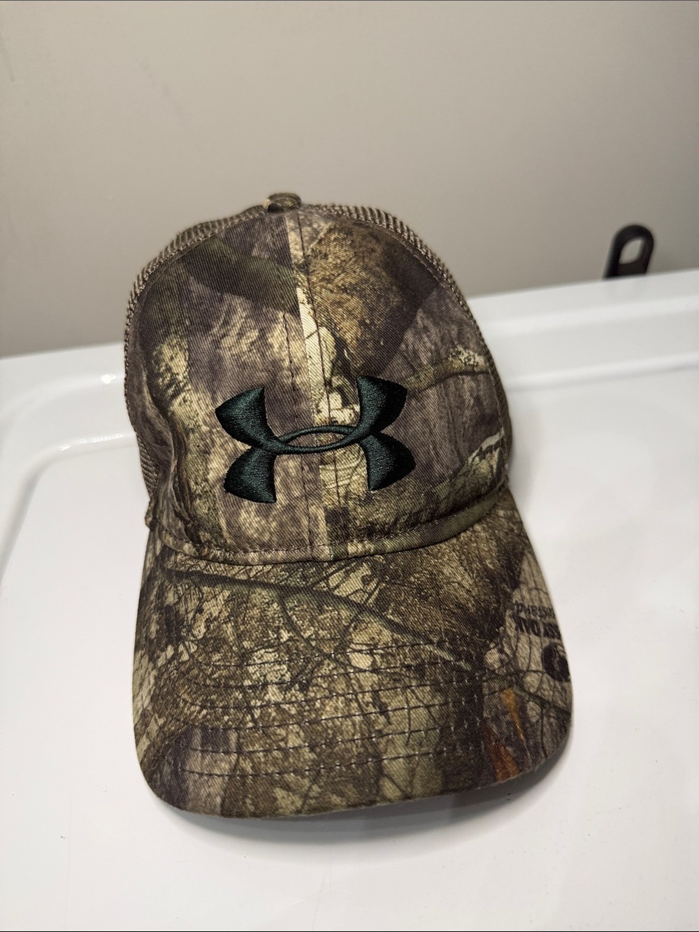 Under Armour Men’s Camouflage Trucker Hat with Black Logo